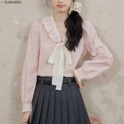 Pink Ruffles Blouse with Bow Tie & Button Detail by Cralom